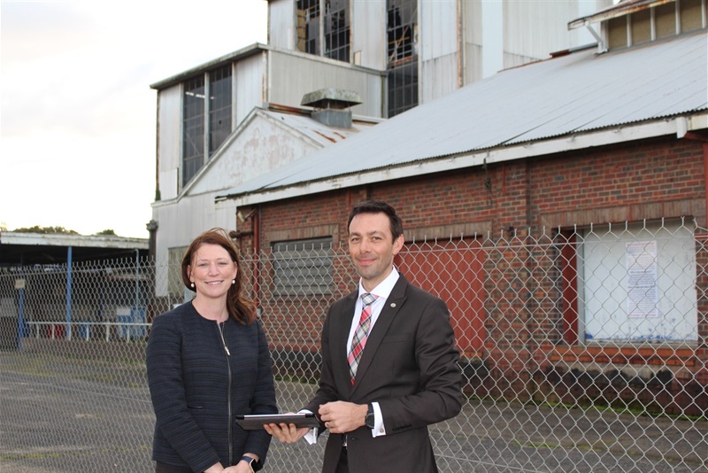 Baw Baw Shire Council CEO Alison Leighton and Director Planning and Economic Development Matthew Cripps standing before derelict buildings at Bonlac site