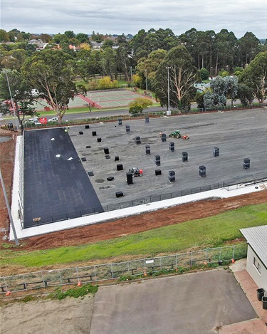 The subsurface drainage cell in installed over the crushed rock base.