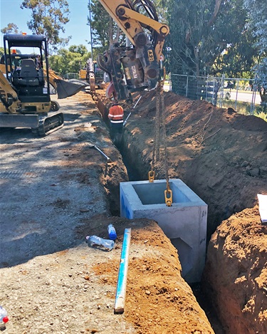 Perimeter drainage being installed, readying the site for the slab to be poured