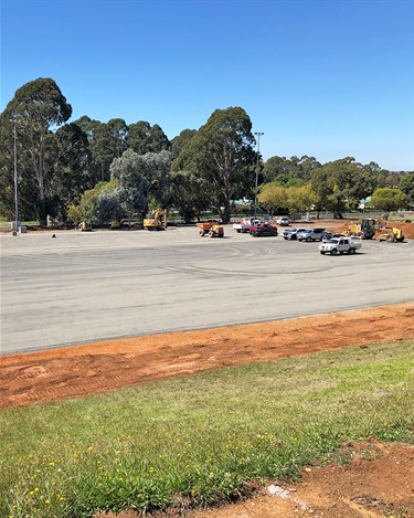 A layer of crushed rock has been spread and compacted in preparation for concreting to begin.