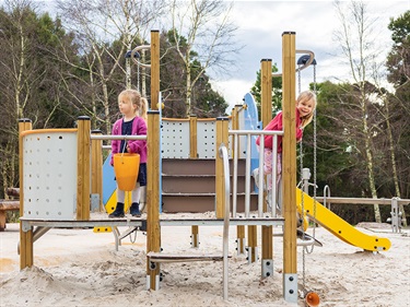 Children enjoy the new park equipment