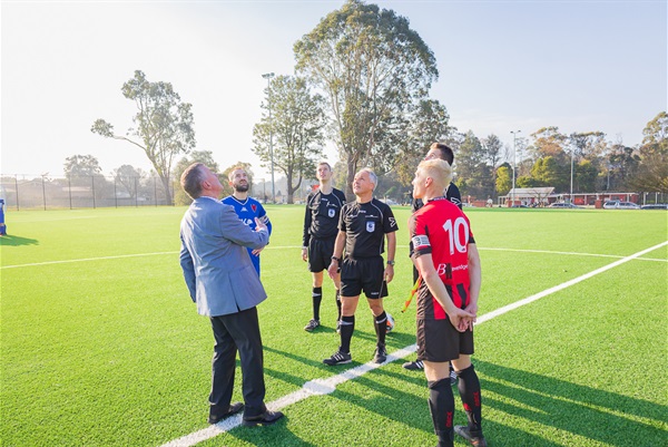Mayor of Baw Baw Shire Councillor Danny Goss flips the coin before kickoff.