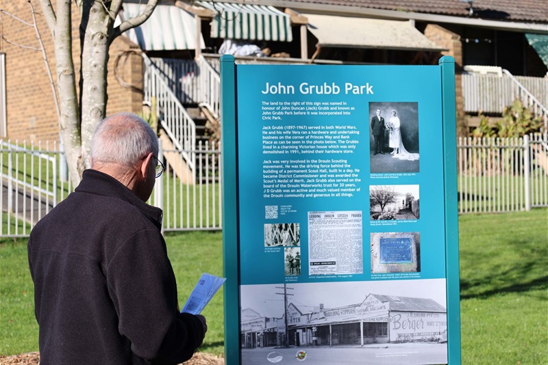 John Franklin looks on at John Grubb Park Sign