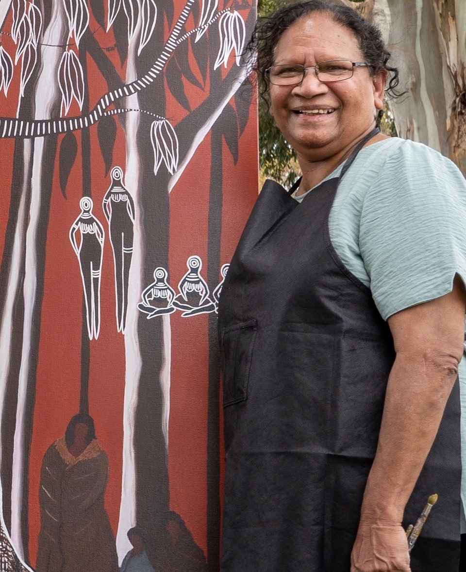 Artist Aunty Eileen Harrison with her painting