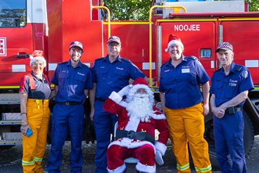 Santa with members of the CFA. Left to right: Jean Edney, Colin Booth, Captain David Backer, Lt Vicky Clarke, Lt Peter Coutts.